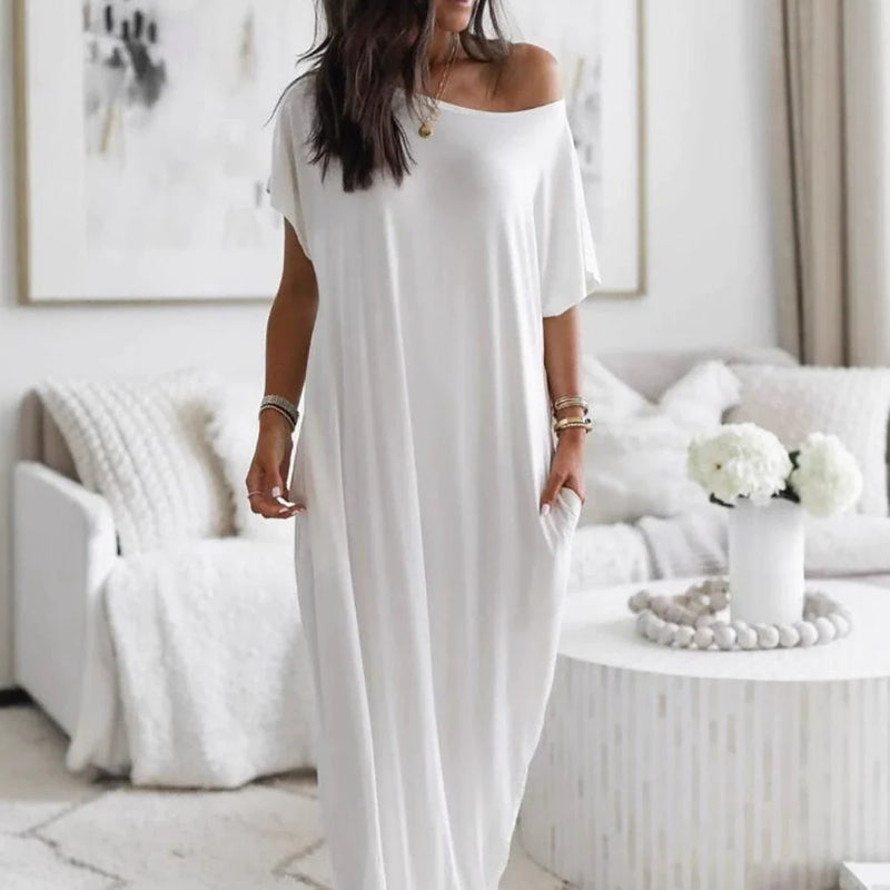 Vestido Altea blanco de corte maxi fluido con hombro asimétrico